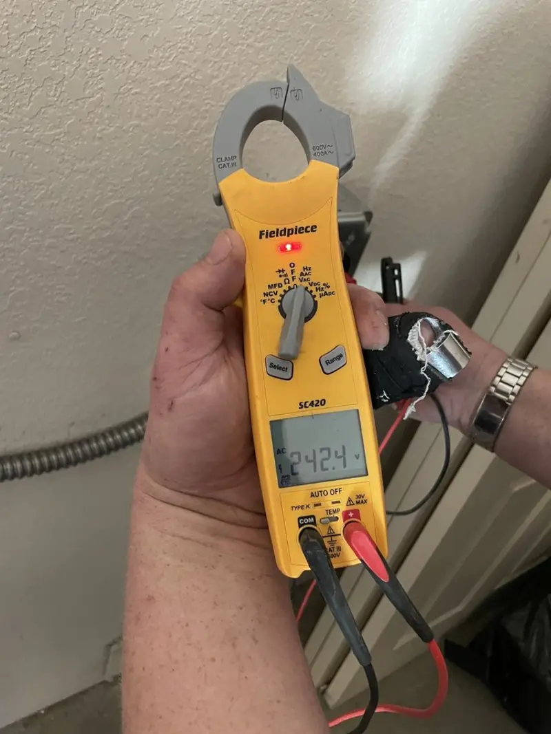 Voltage testing with clamp meter during Outlet Installation in Ossipee
